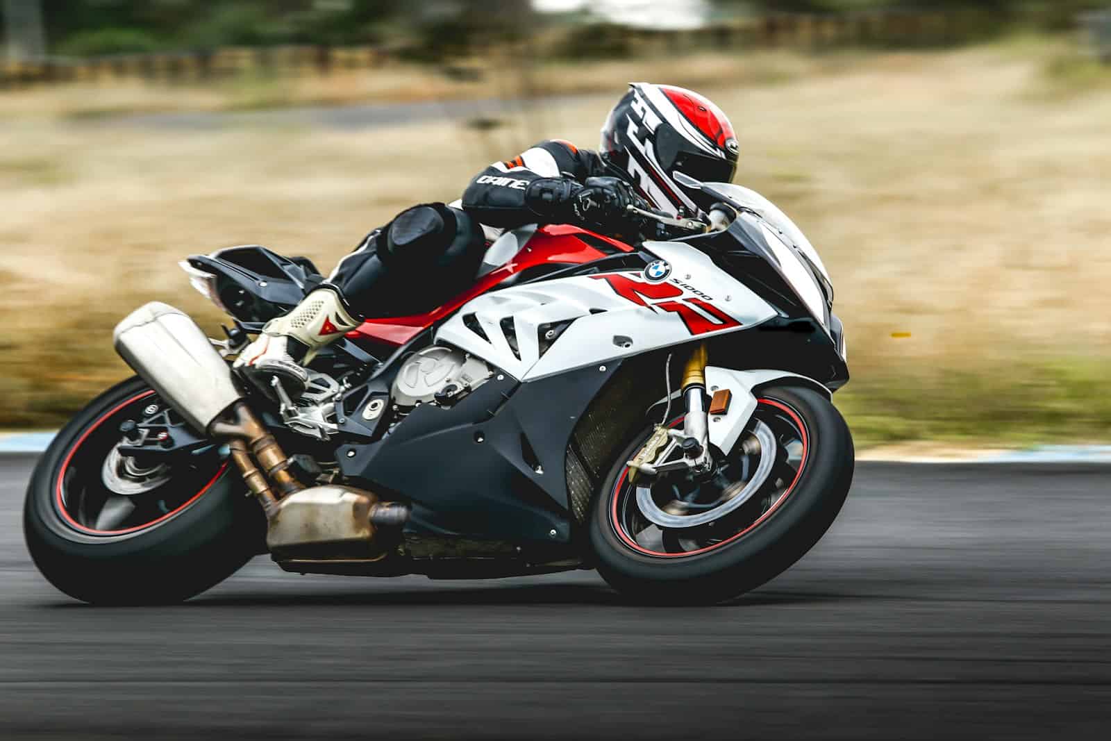 Motorcycle rider leaning into a corner on a sport bike
