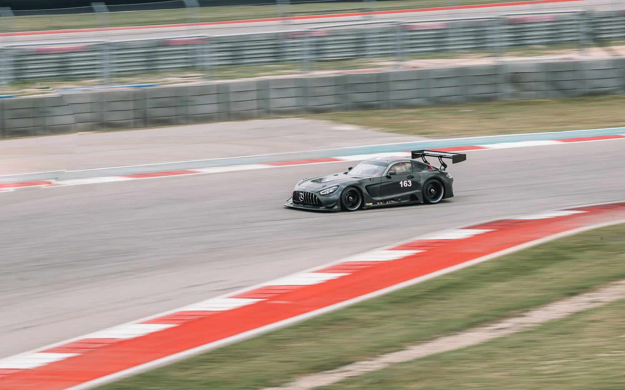 Race car at speed on a road course
